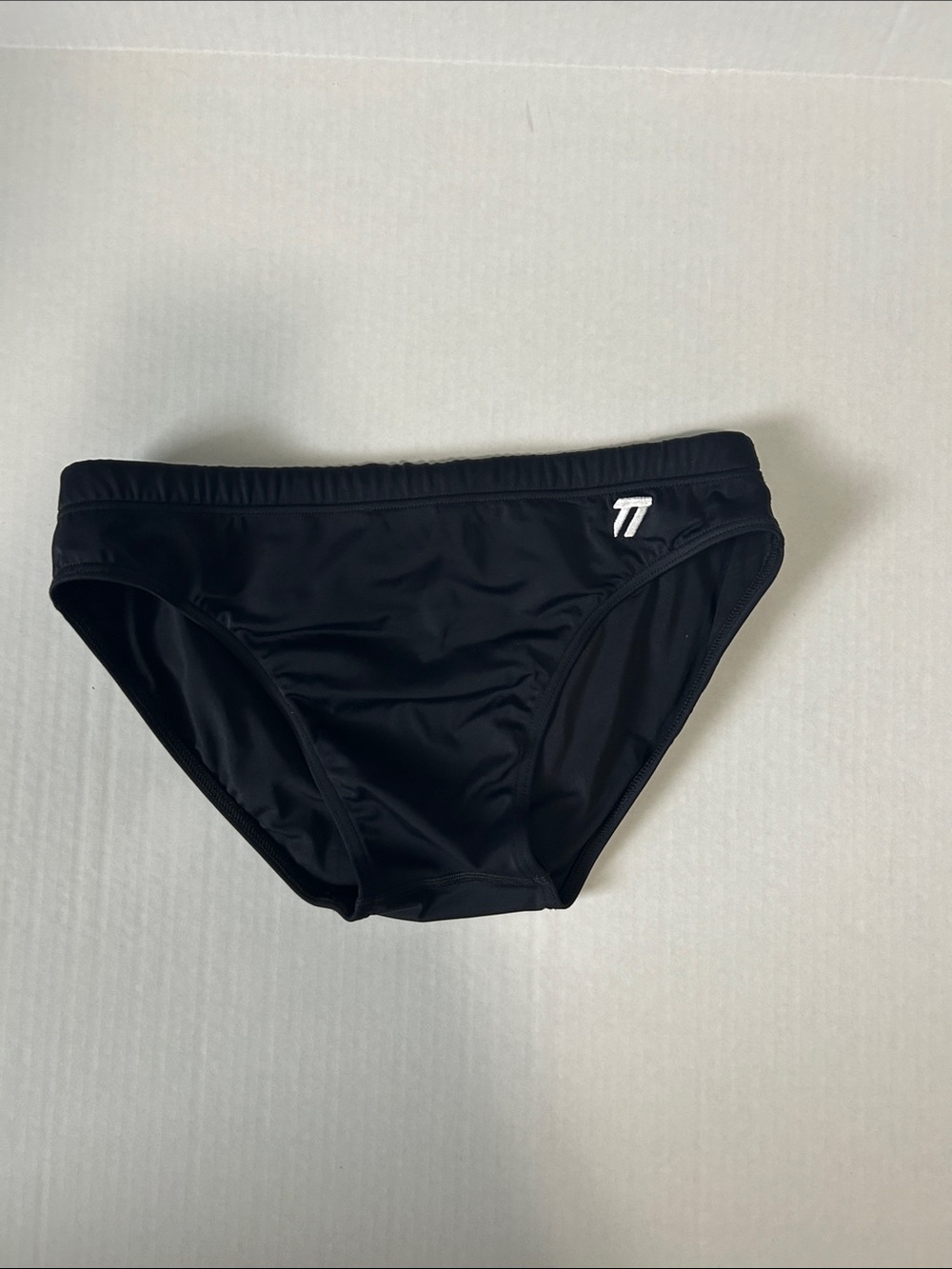 Petra Fashions Black Swim Trunks with White Logo Accent